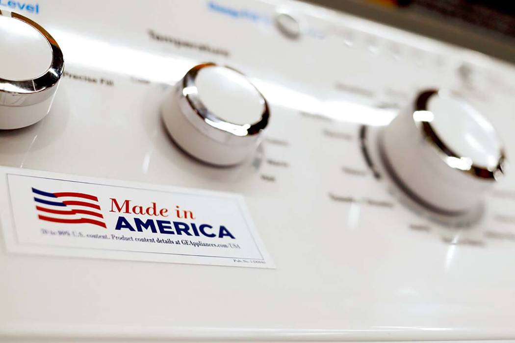A May 9, 2019, file photo shows a General Electric washing machine with a label advertising it ...