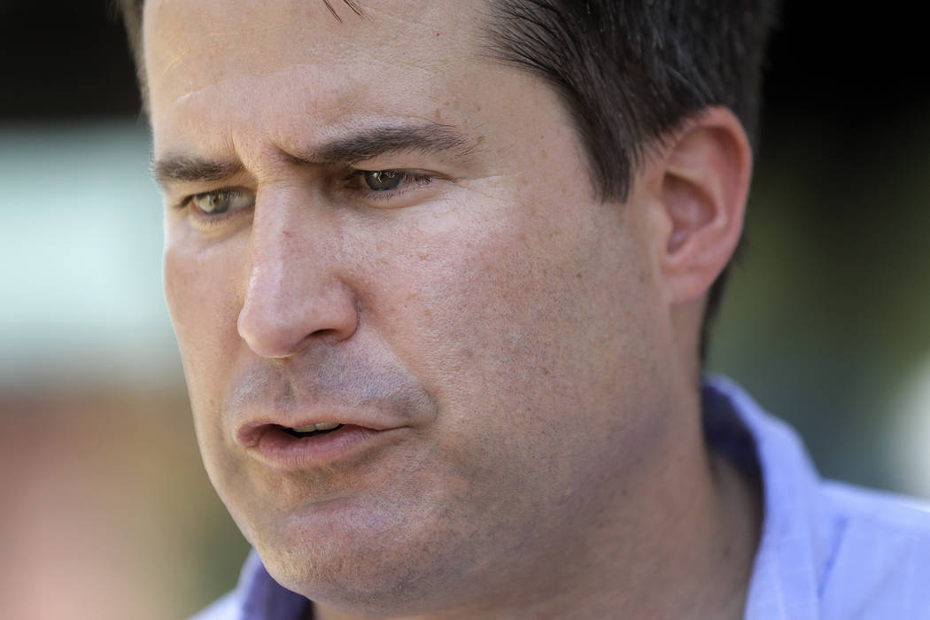 Democratic presidential candidate Rep. Seth Moulton, D-Mass., speaks with reporters, Sunday, Au ...