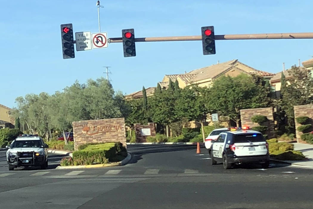 Police respond to the scene of a crash at Red Rock Ranch Drive and Sahara Avenue on Friday, Aug ...