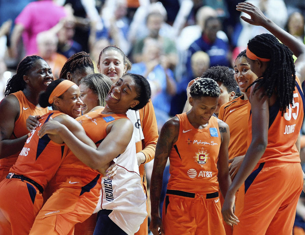 Connecticut Sun players celebrate a win over the Las Vegas Aces in a WNBA basketball game Frida ...