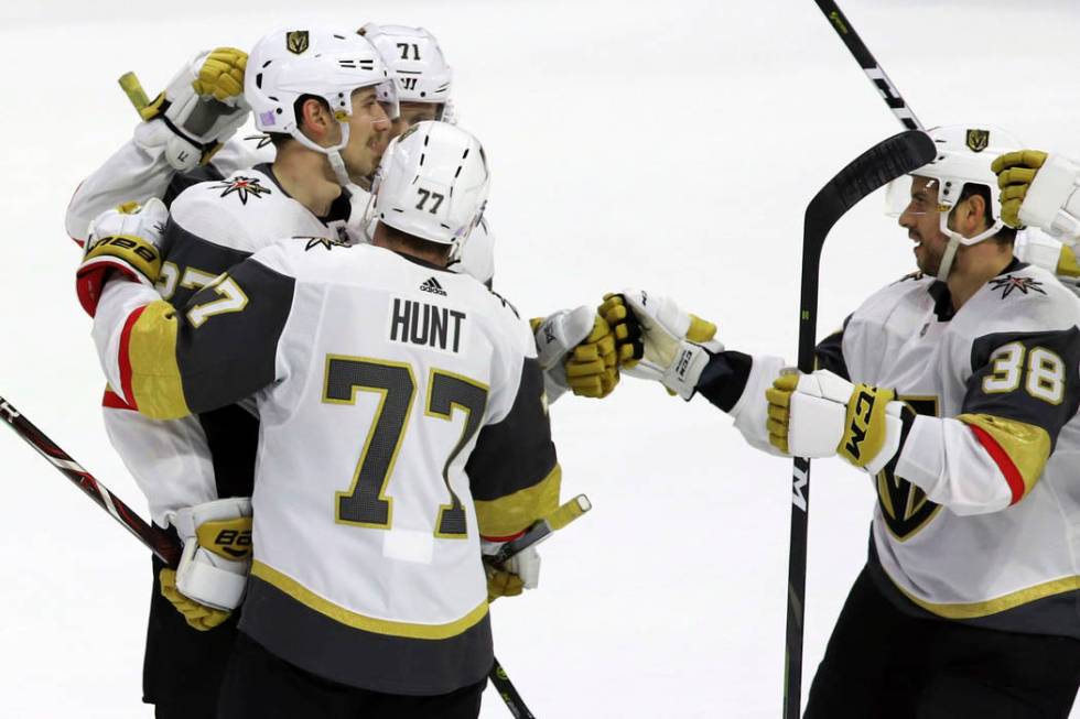 Vegas Golden Knights defenseman Shea Theodore (27) celebrates his power-play goal against the O ...
