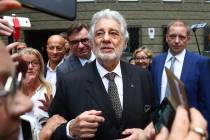 Placido Domingo talks to fans at the 'Festspielhaus' opera house after he performed 'Luisa Mill ...