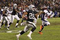 Oakland Raiders running back Doug Martin (28) runs with the football as Denver Broncos inside l ...
