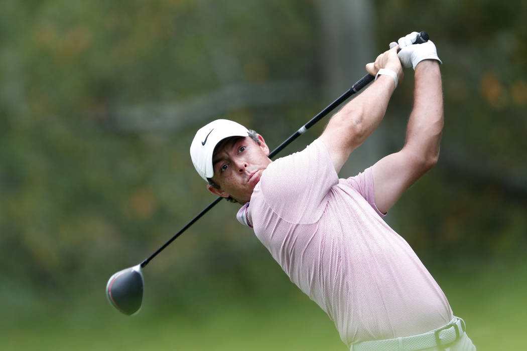 Rory McIlroy hits from the fifth tee during the final round of the Tour Championship golf tourn ...