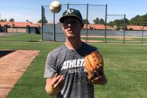 Oakland Athletics rookie pitcher Nathan Patterson tosses a baseball, in Mesa, Ariz. on Friday, ...