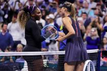 Serena Williams, left, shakes hands with Maria Sharapova after their first-round match at the U ...