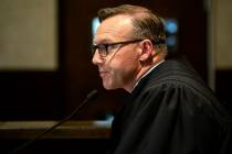 Judge Thad Balkman reads a summary of his decision in the opioid trial at the Cleveland County ...
