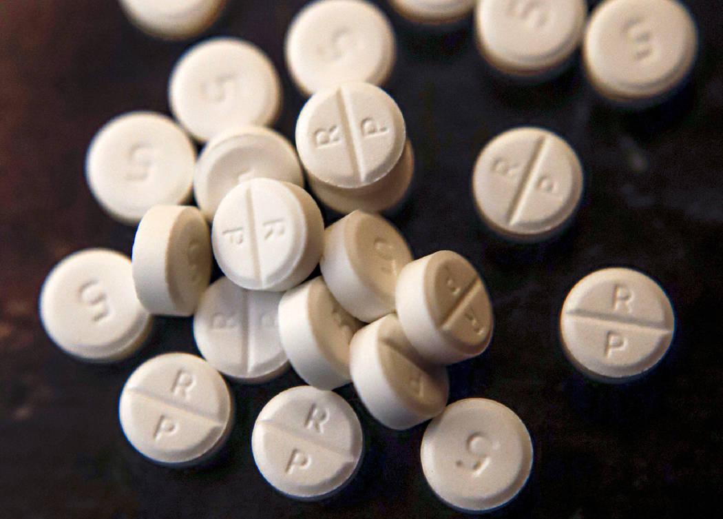FILE - This June 17, 2019, file photo shows 5-mg pills of Oxycodone. The first judgment is expe ...