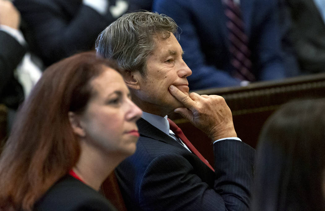 Defense attorney Larry Ottaway, right, listens as Judge Thad Balkman reads a summary of his dec ...