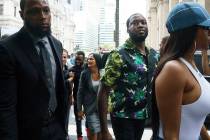 Rapper Meek Mill, center, arrives at the Criminal Justice Center in Philadelphia on Tuesday, Au ...