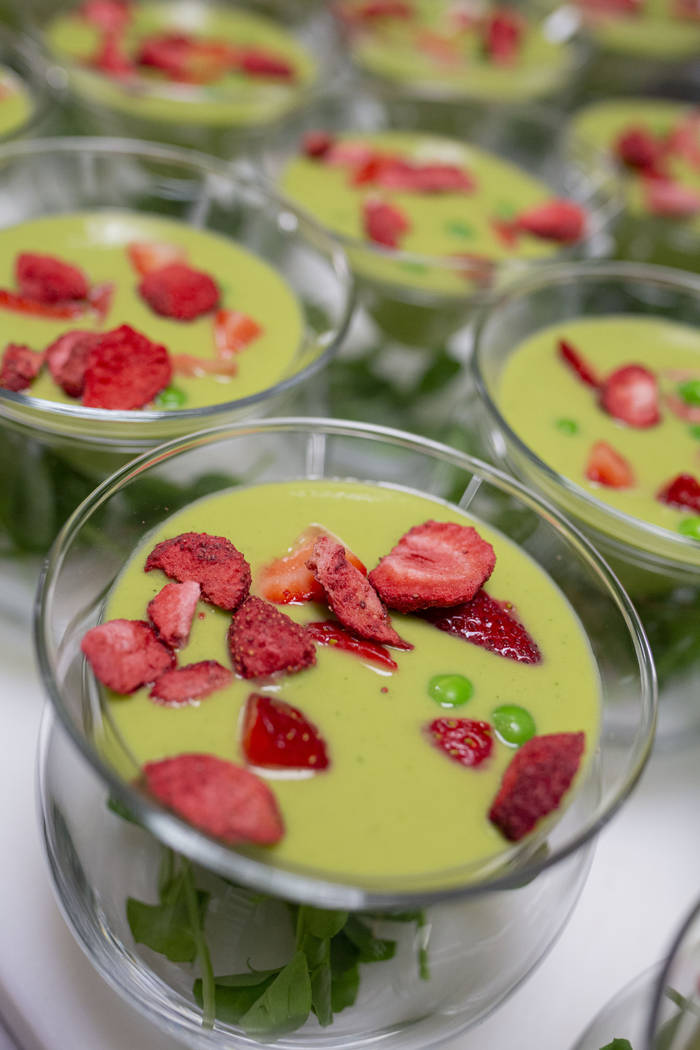 A chilled sweet pea, spinach and mint soup with basil-mint foam and strawberries for the recrea ...
