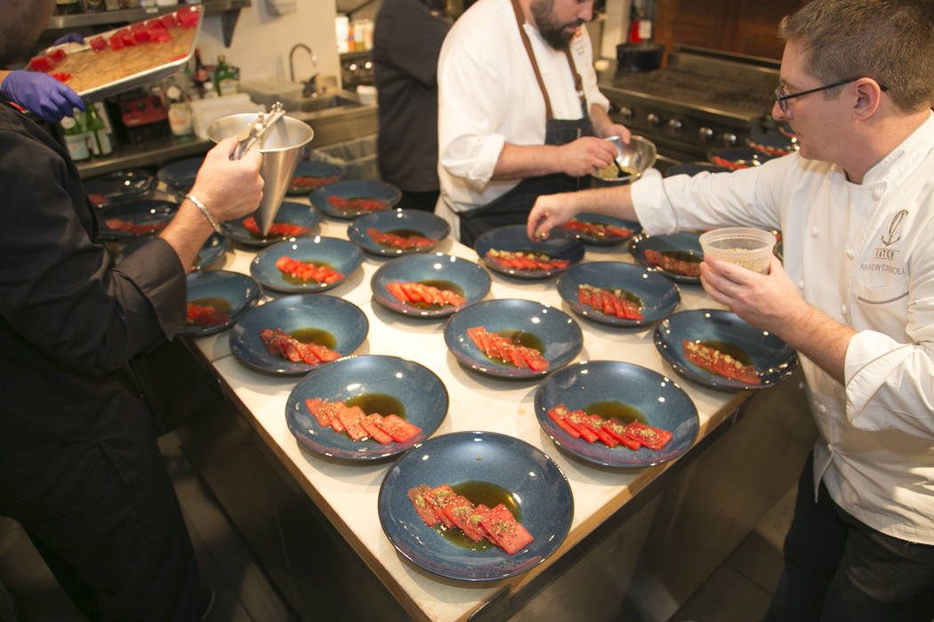 Photo by Rinah Oh Andrew Carroll, front, prepares Compressed Watermelon at the James Beard Hous ...