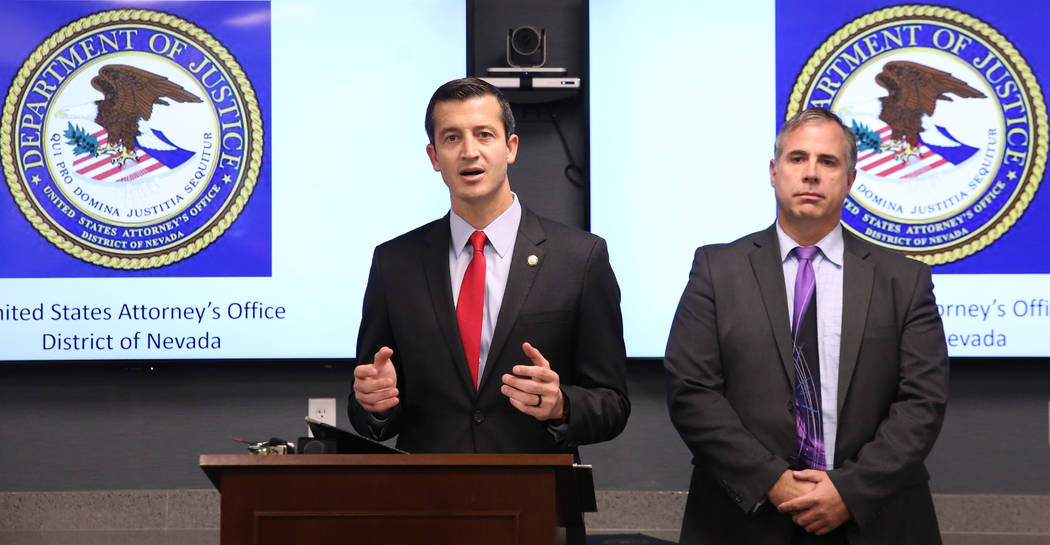 Ray Johnson, right, assistant special agent in charge of the FBI Las Vegas office, listens as N ...