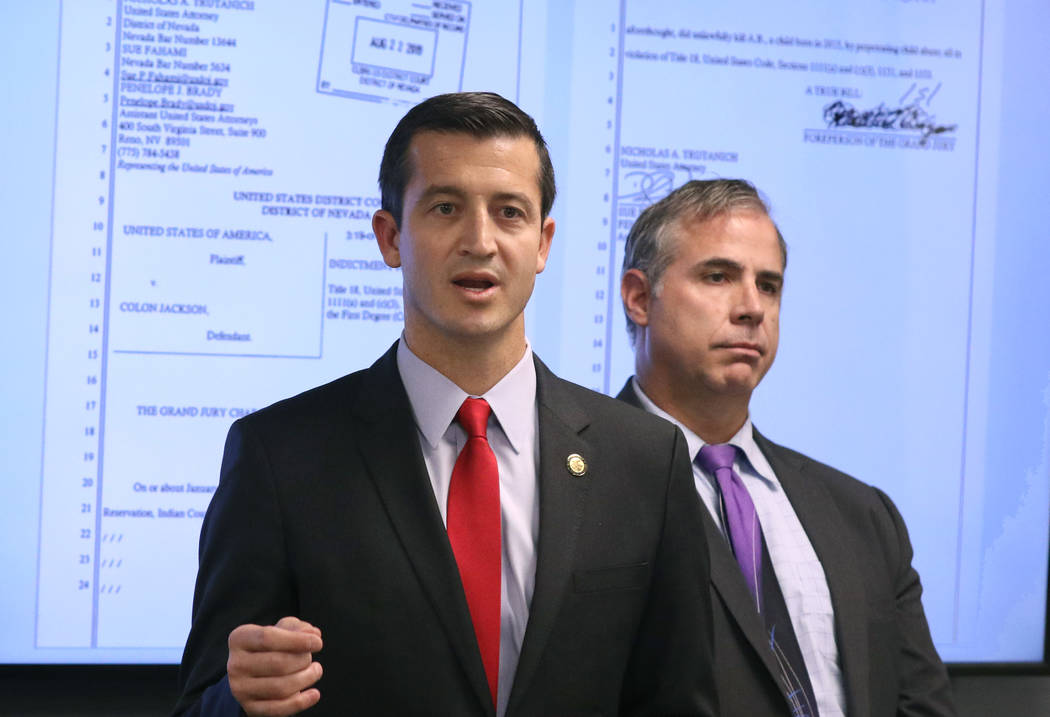 U.S. Attorney Nicholas Trutanich, left, speaks during a news conference on Tuesday, Aug. 27, 20 ...