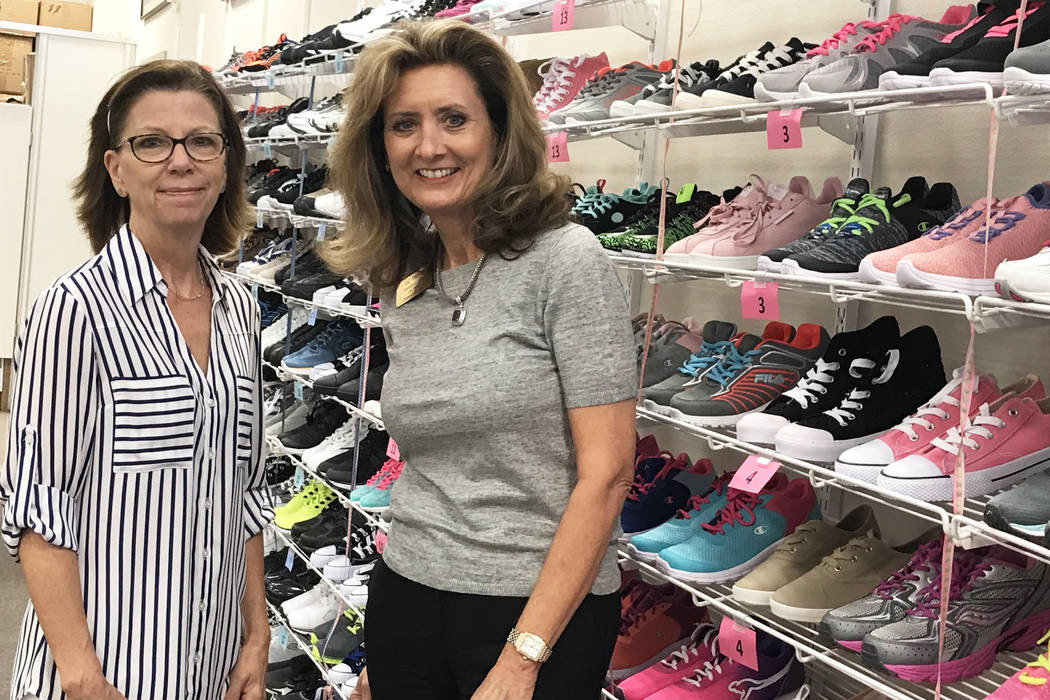 Assistance League of Las Vegas President Liz Gibson, right, and Laura Rehberger, left, who’s ...