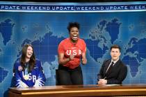 This March 3, 2018 photo released by NBC shows Leslie Jones, center, flanked by Ice Hockey Olym ...