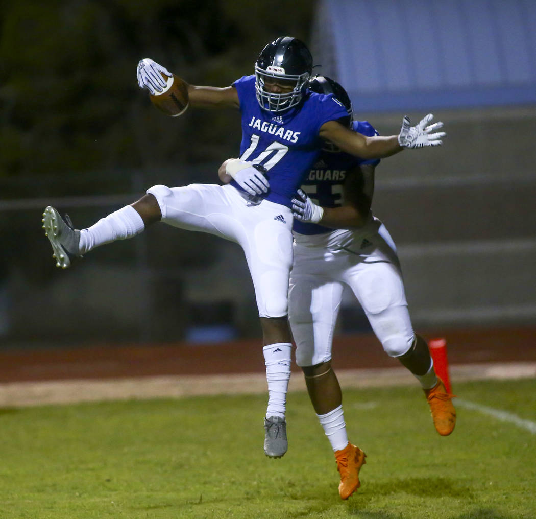 Desert Pines' Malik Brooks (10) celebrates his touchdown with Tiaoalii Savea during the second ...