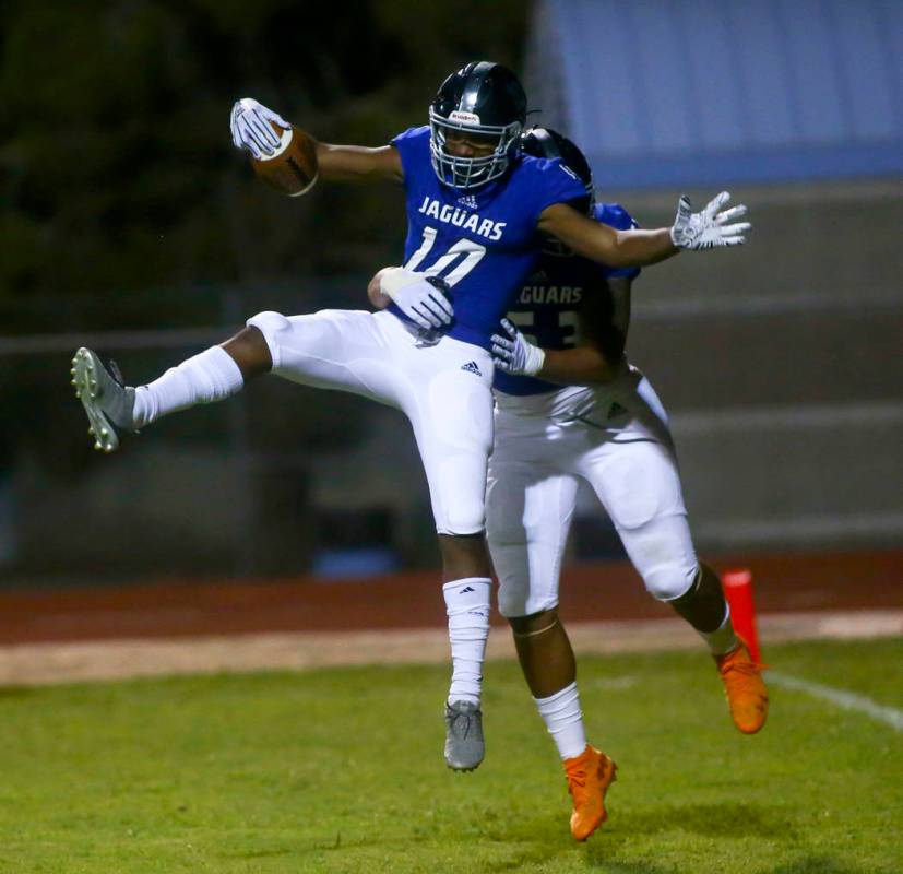 Desert Pines' Malik Brooks (10) celebrates his touchdown with Tiaoalii Savea during the second ...