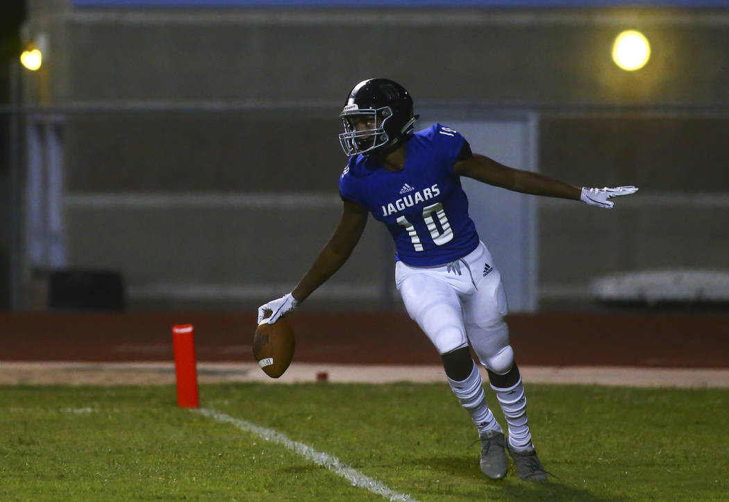 Desert Pines' Malik Brooks (10) celebrates his touchdown during the second half of a football g ...