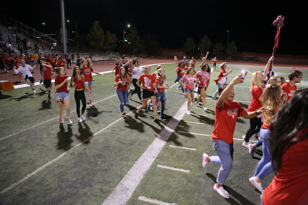 Arbor View fans run onto the field to celebrate a win against American Fork in the football gam ...