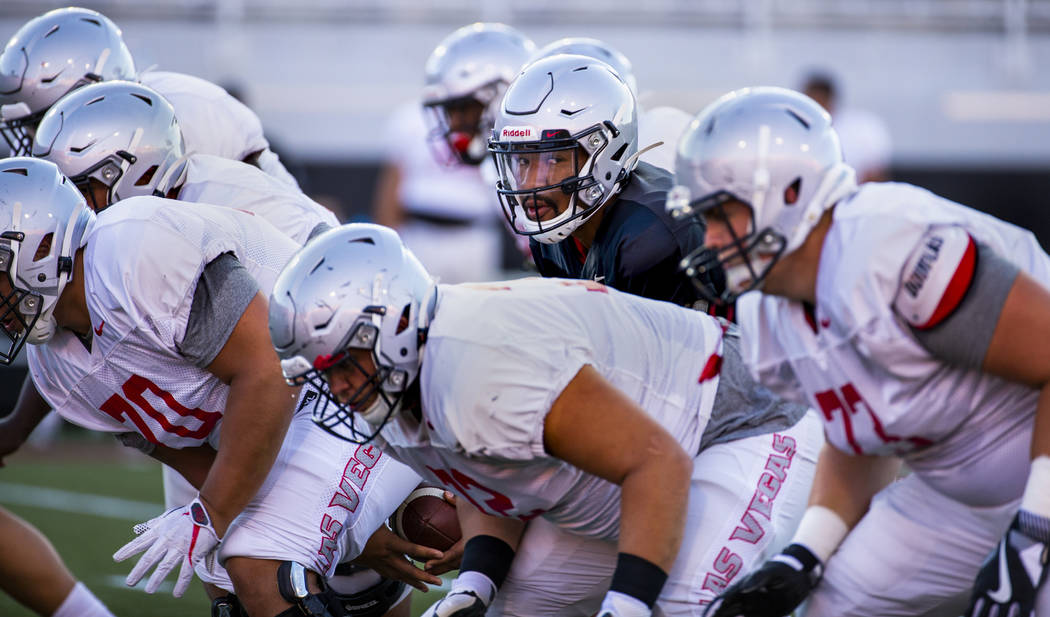 UNLV QB Armani Rogers (1) under the center during their first major scrimmage of football train ...