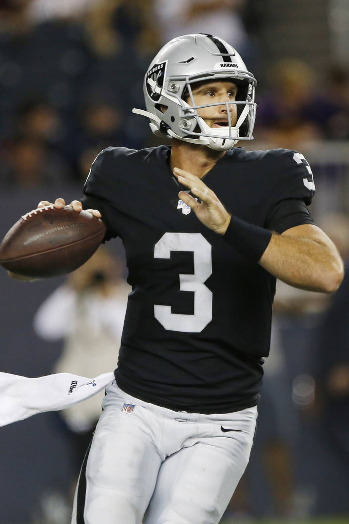 Oakland Raiders quarterback Nathan Peterman looks for a receiver during the second half of the ...