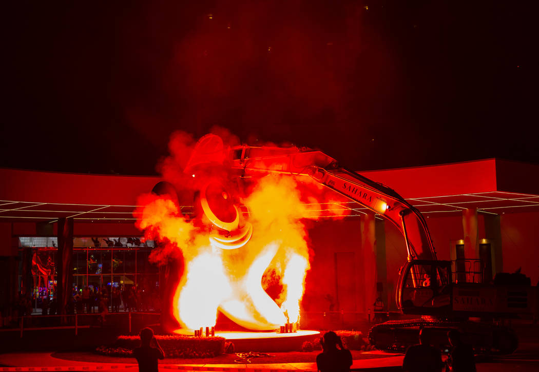 Flames shoot into the air prior to the removal of the "Sam by Starck" statue at the SLS Las Veg ...