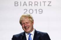 Britain's Prime Minister Boris Johnson smiles during his final press conference at the G7 summi ...