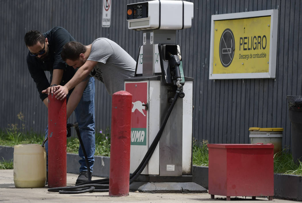 Citizens stock up on gasoline a few hours before the passing of Hurricane Dorian, in Canovanas, ...