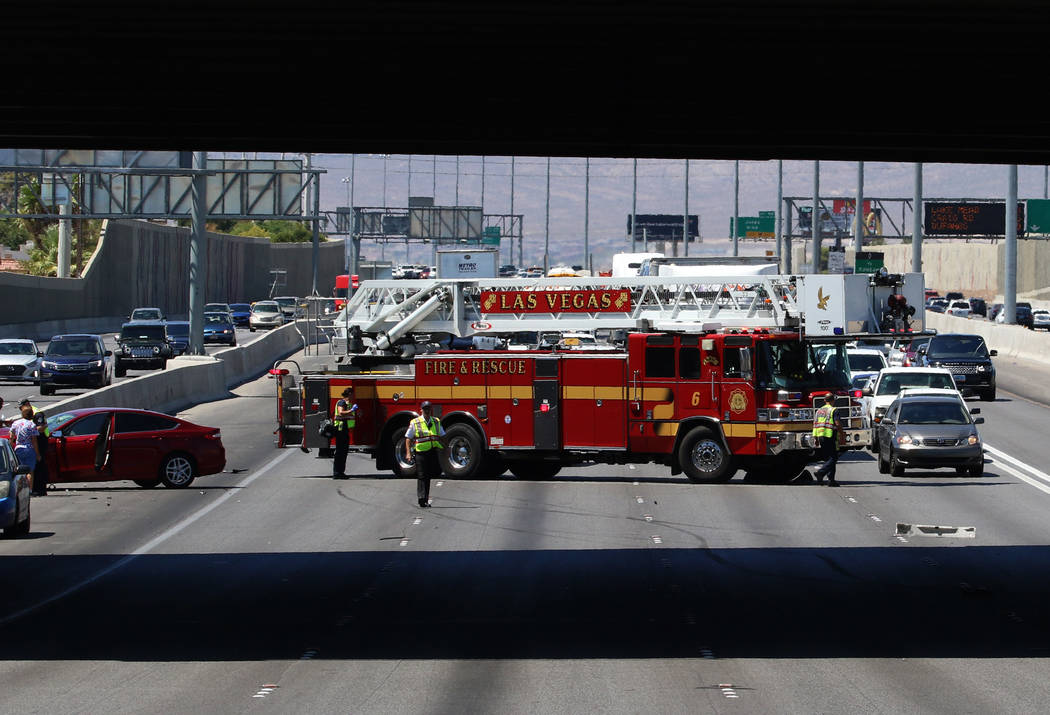 Las Vegas firefighters at the scene of multi-vehicle crash at US Highway 95 southbound near Dec ...