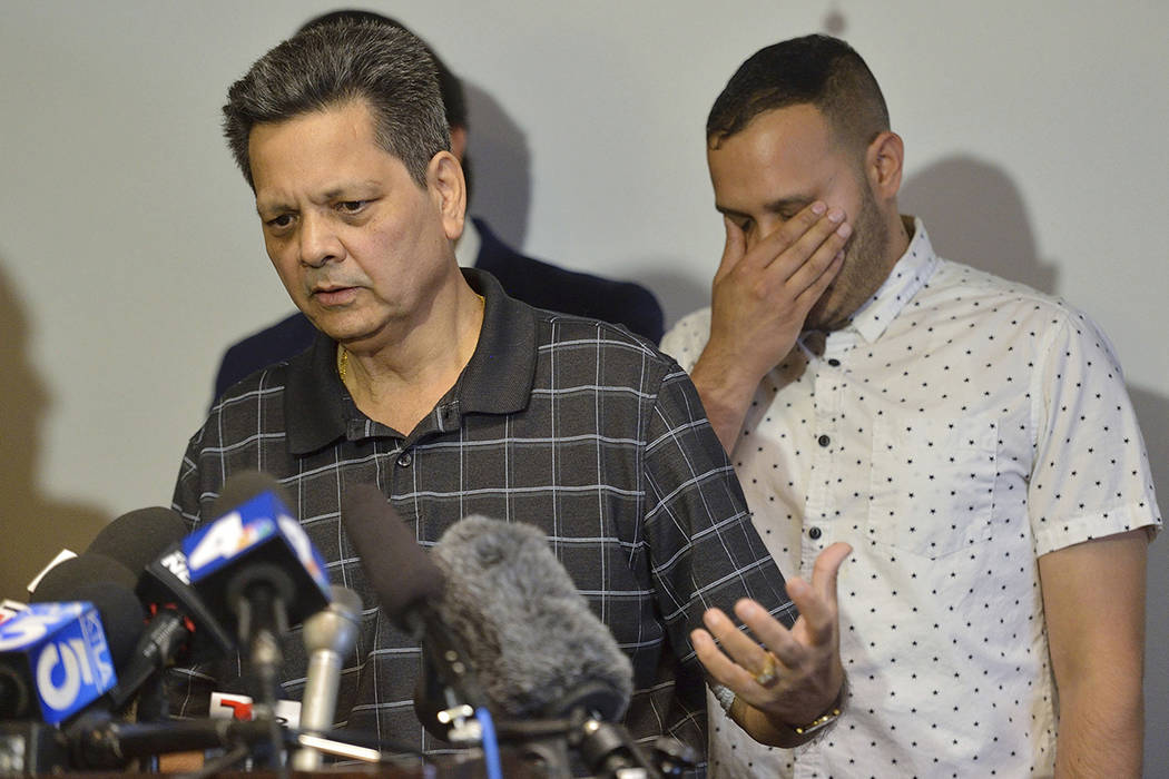 Kevin French react as his father, Russell French, describe the family's ordeal during a news co ...