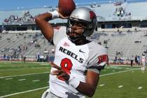 UNLV starting quarterback Caleb Herring warms up before taking on UNR at Mackay Stadium in Reno ...