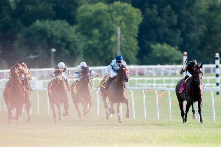 Julio Garcia, from right, riding Bound for Nowhere, and James Graham, riding Great Wide Open, l ...