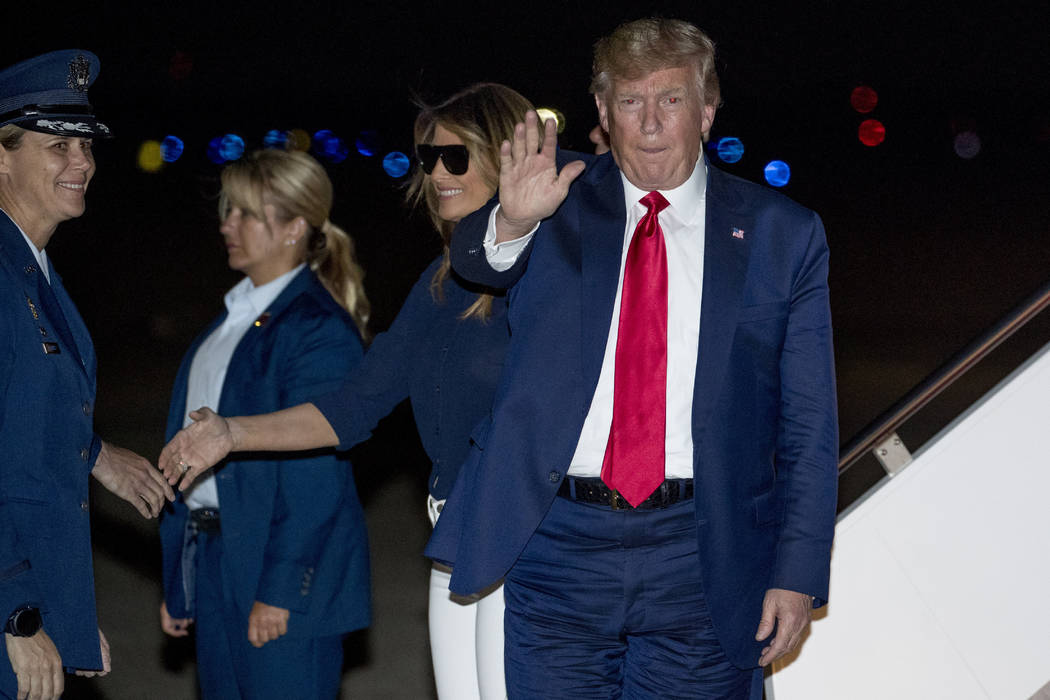 President Donald Trump and first lady Melania Trump arrive at Andrews Air Force Base, Md., Tues ...