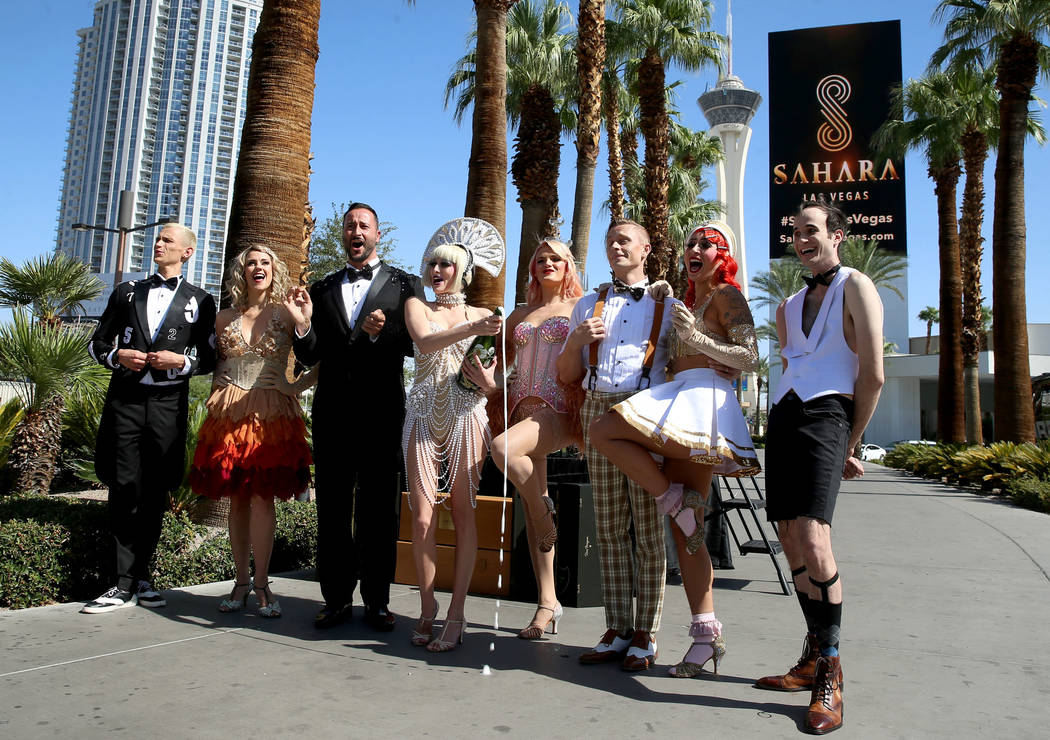 Cast members for Blanc de Blanc participate during the Sahara Las Vegas rebranding event outsid ...