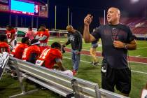 Head coach Tony Sanchez chats with fans in the stands during the UNLV football team scrimmage a ...