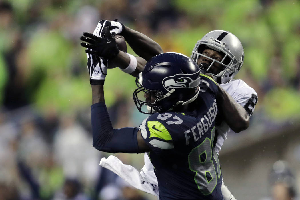Seattle Seahawks wide receiver Jazz Ferguson (87) makes a 41-yard catch around the defense of O ...