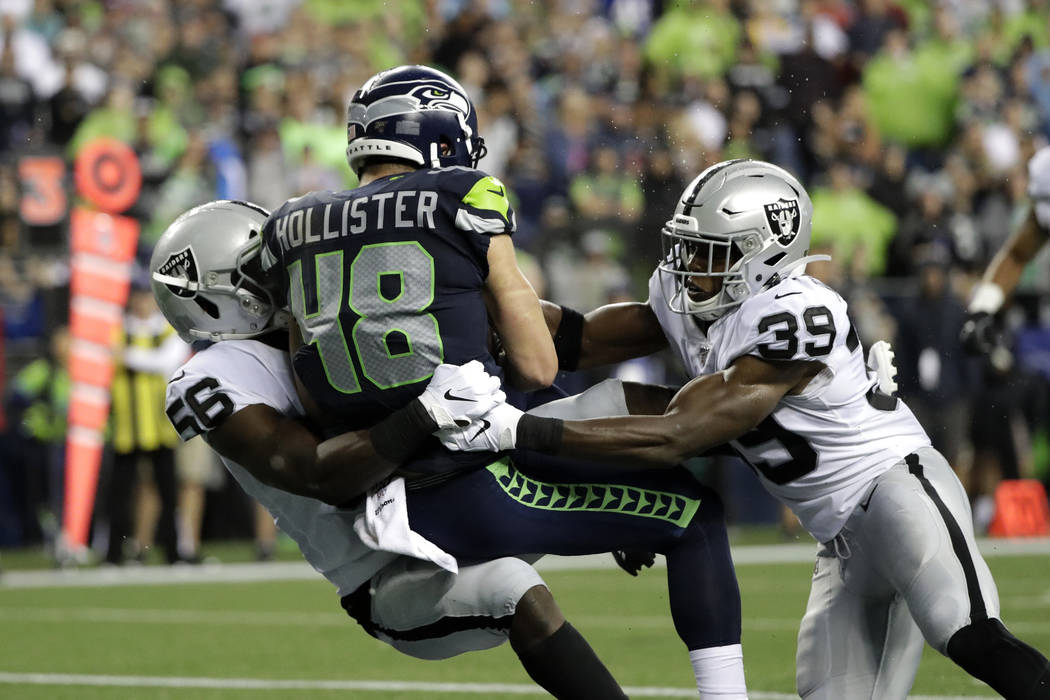 Seattle Seahawks tight end Jacob Hollister (48) scores a touchdown after a reception as he is t ...