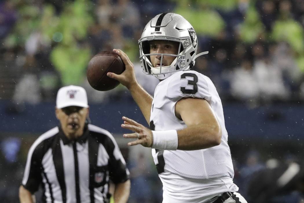 Oakland Raiders quarterback Nathan Peterman passes against the Seattle Seahawks during the firs ...