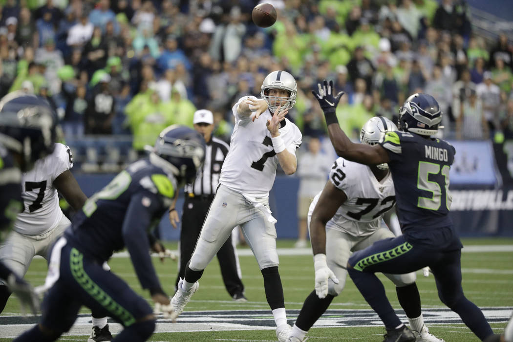 Oakland Raiders quarterback Mike Glennon (7) passes against the Seattle Seahawks during the fir ...