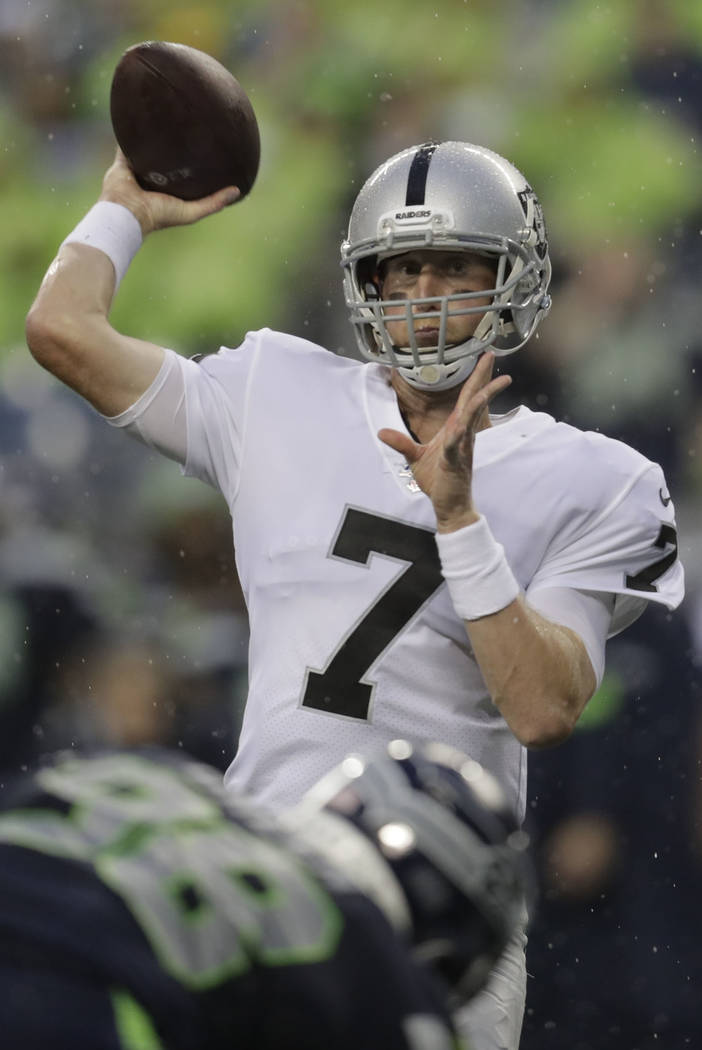 Oakland Raiders quarterback Mike Glennon passes against the Seattle Seahawks during the first h ...