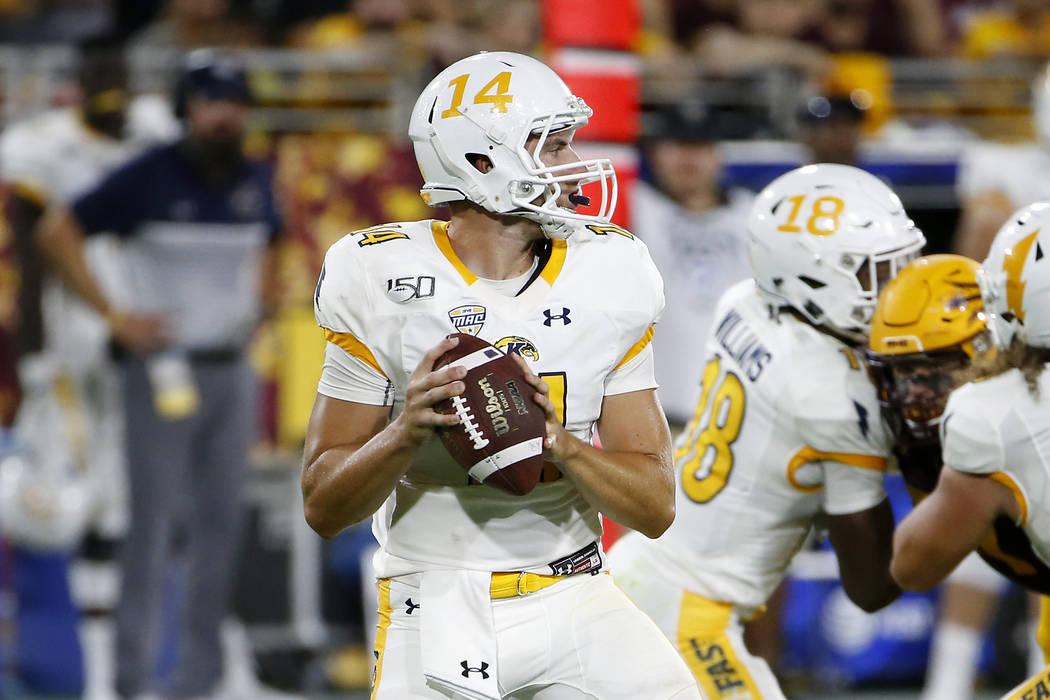 Kent State quarterback Dustin Crum (14) looks to pass the ball against Arizona State during the ...