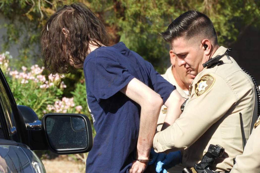 Las Vegas police take Tyler Anthony Sears into custody as they investigate a stabbing in the 65 ...