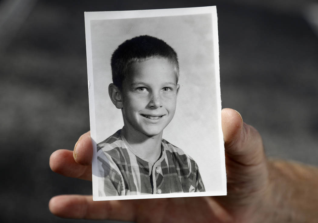 In this Wednesday, Aug. 21, 2019 photo, Greg Hunt holds a school photo of himself in St. Peters ...