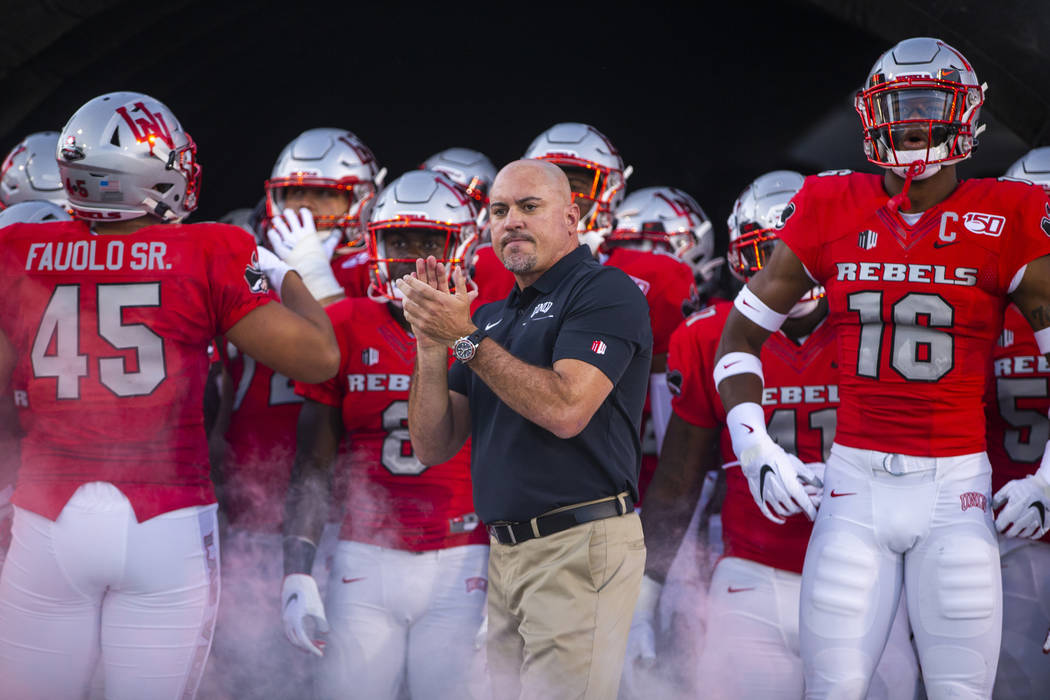 UNLV Rebels head coach Tony Sanchez waits with his team to take the field versus Southern Utah ...