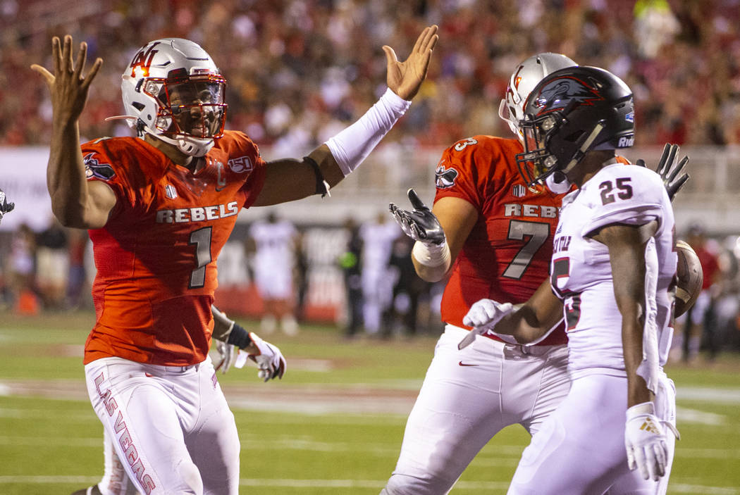 UNLV Rebels quarterback Armani Rogers (1) celebrates his touchdown over Southern Utah during th ...
