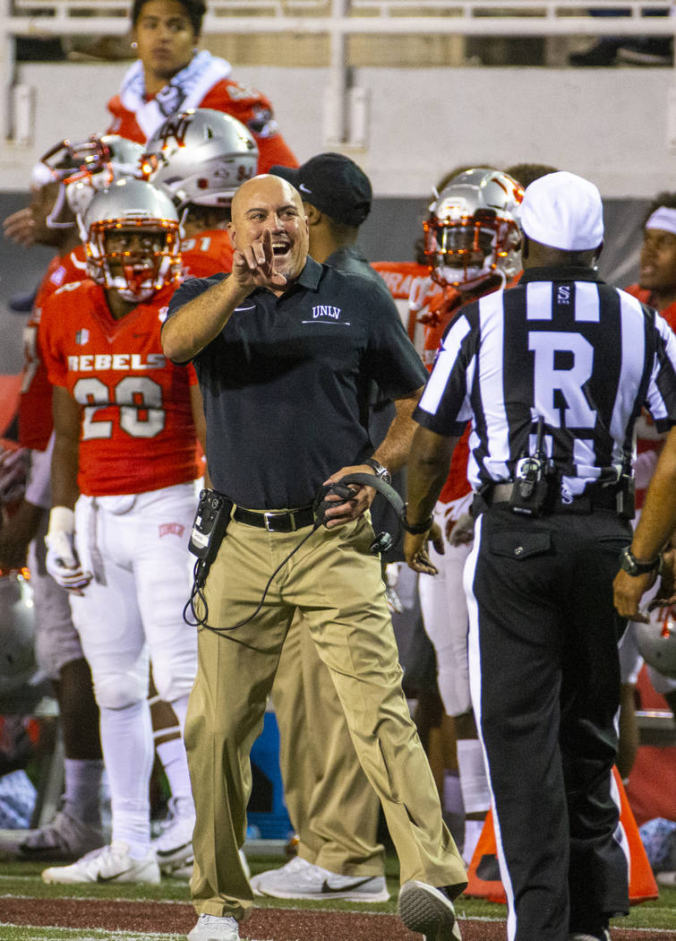 UNLV Rebels head coach Tony Sanchez argues with a referee versus Southern Utah during the firs ...