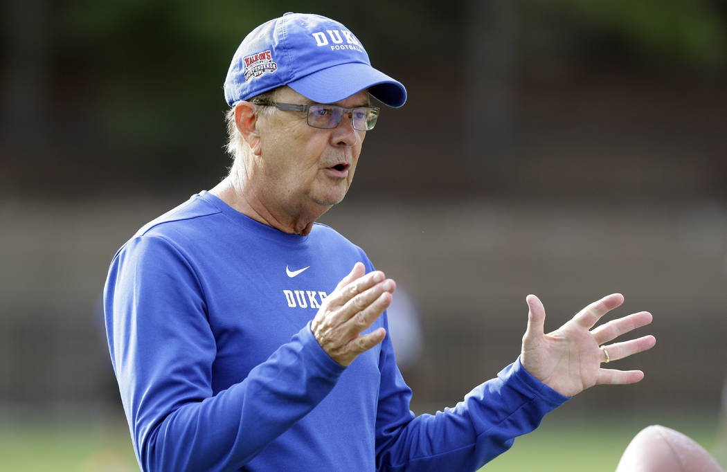 In this photo taken Friday, Aug. 2, 2019, Duke head coach David Cutcliffe directs his players d ...