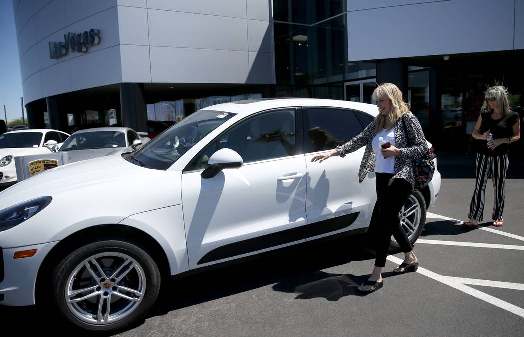 Melanie Cohen, left, and Ann Sachs, both of Las Vegas, prepare to test drive a Macan at Gaudin ...