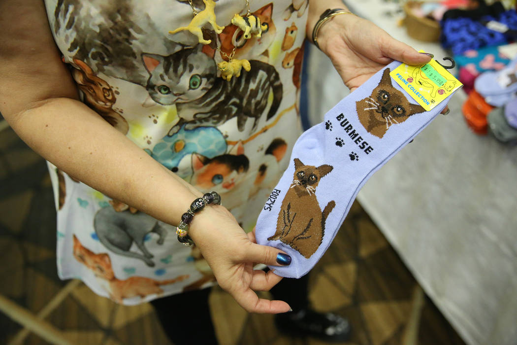 Cat themed socks for sale by Paws and Pals during The International Cat Association’s (T ...
